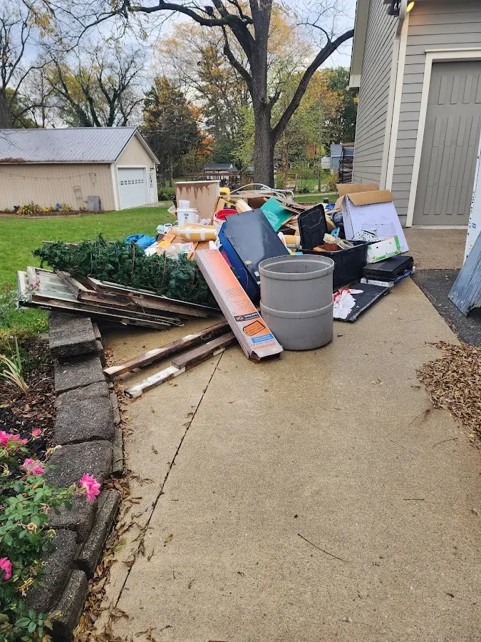 Dumpster being loaded with debris for Commercial Dumpster Rental in Peachtree City